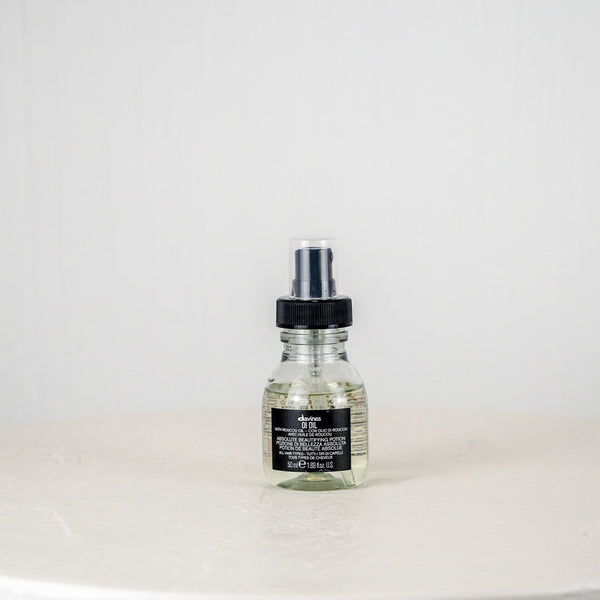 Clear bottle with black cap on a white background