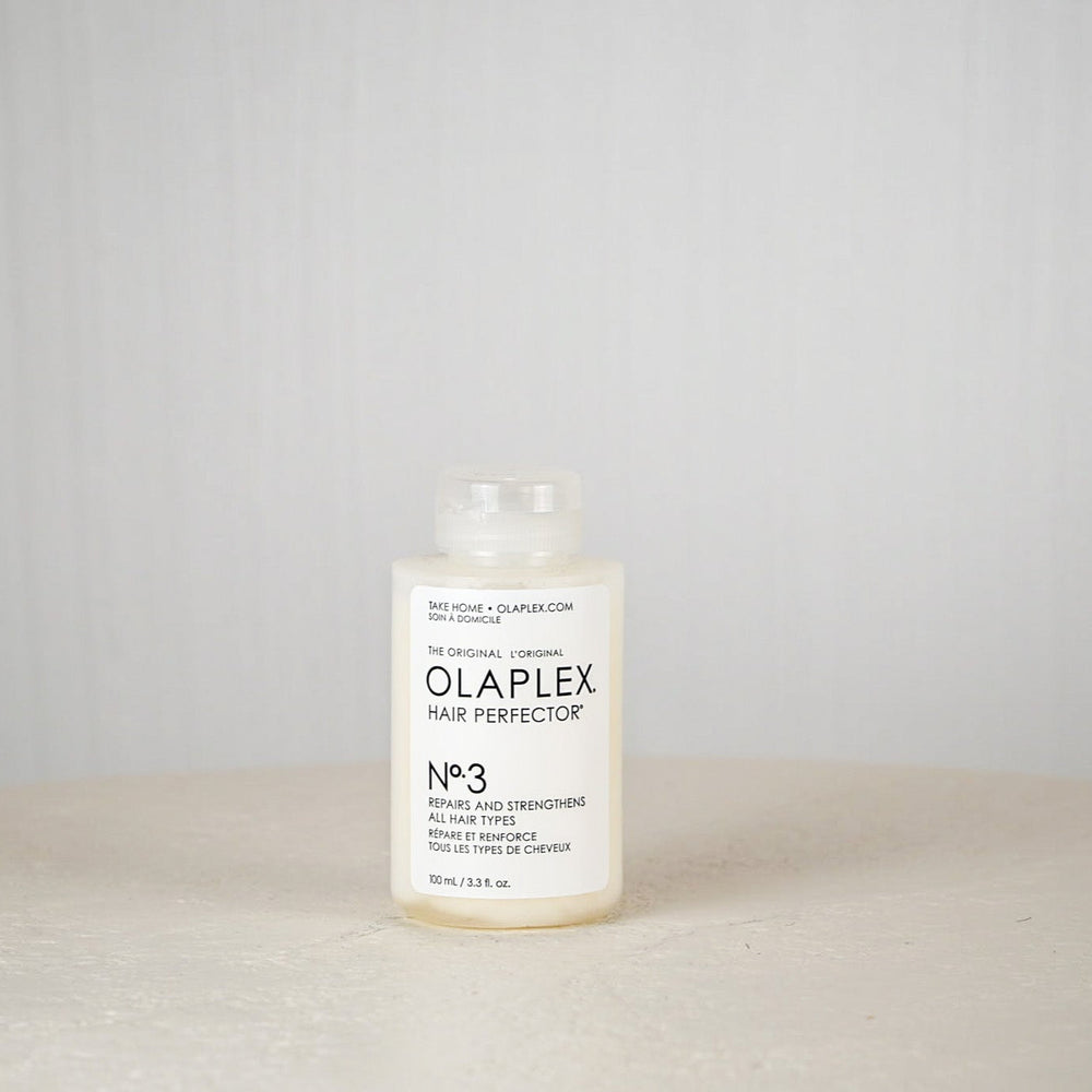 Olaplex Hair Perfector No.3 bottle on a neutral background