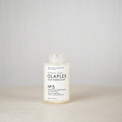 Olaplex Hair Perfector No.3 bottle on a neutral background