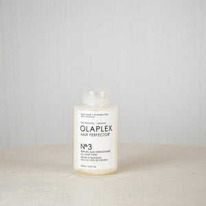 Olaplex Hair Perfector No.3 bottle on a neutral background