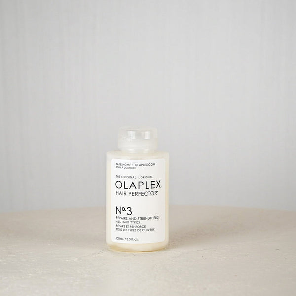 Olaplex Hair Perfector No.3 bottle on a neutral background