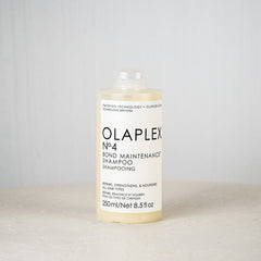 Olaplex No.4 Bond Maintenance Shampoo bottle on a light gray background