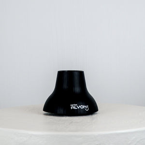 Black lampshade with 'ALYON' branding on a white surface against a light gray background