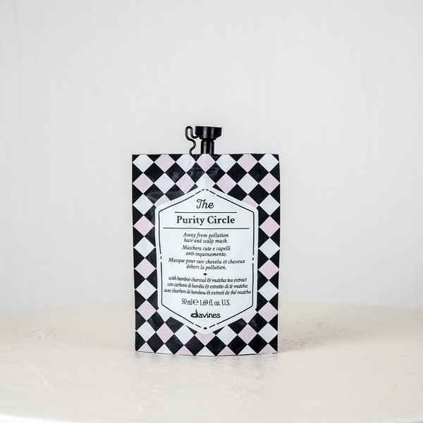 Black and white checkered box with text on a white surface