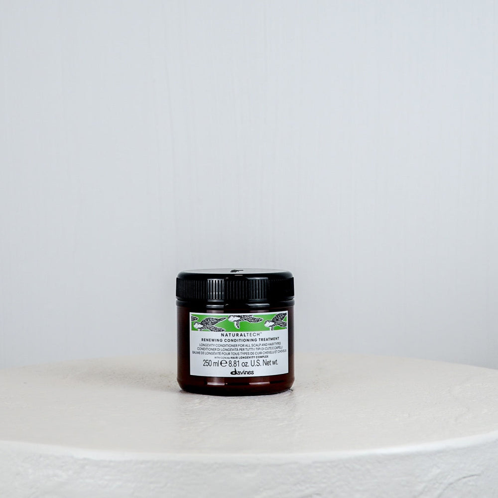 Jar of Davines hair product on a white background