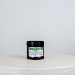 Jar of Davines hair product on a white background