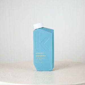 Blue bottle with white cap on a white surface against a light gray background