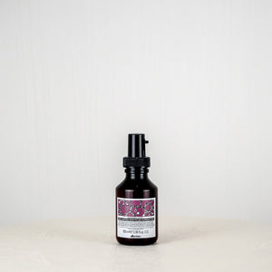 Skincare bottle with a purple label on a white background