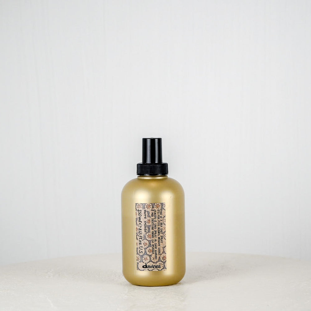 Brown textured package with a white label on a white surface against a light gray background