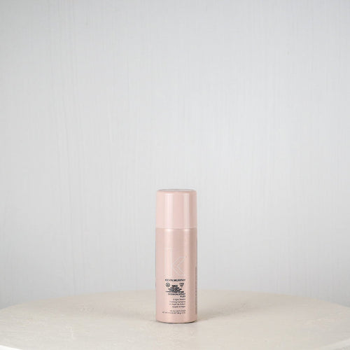 Skincare bottle on a white surface with a light gray background