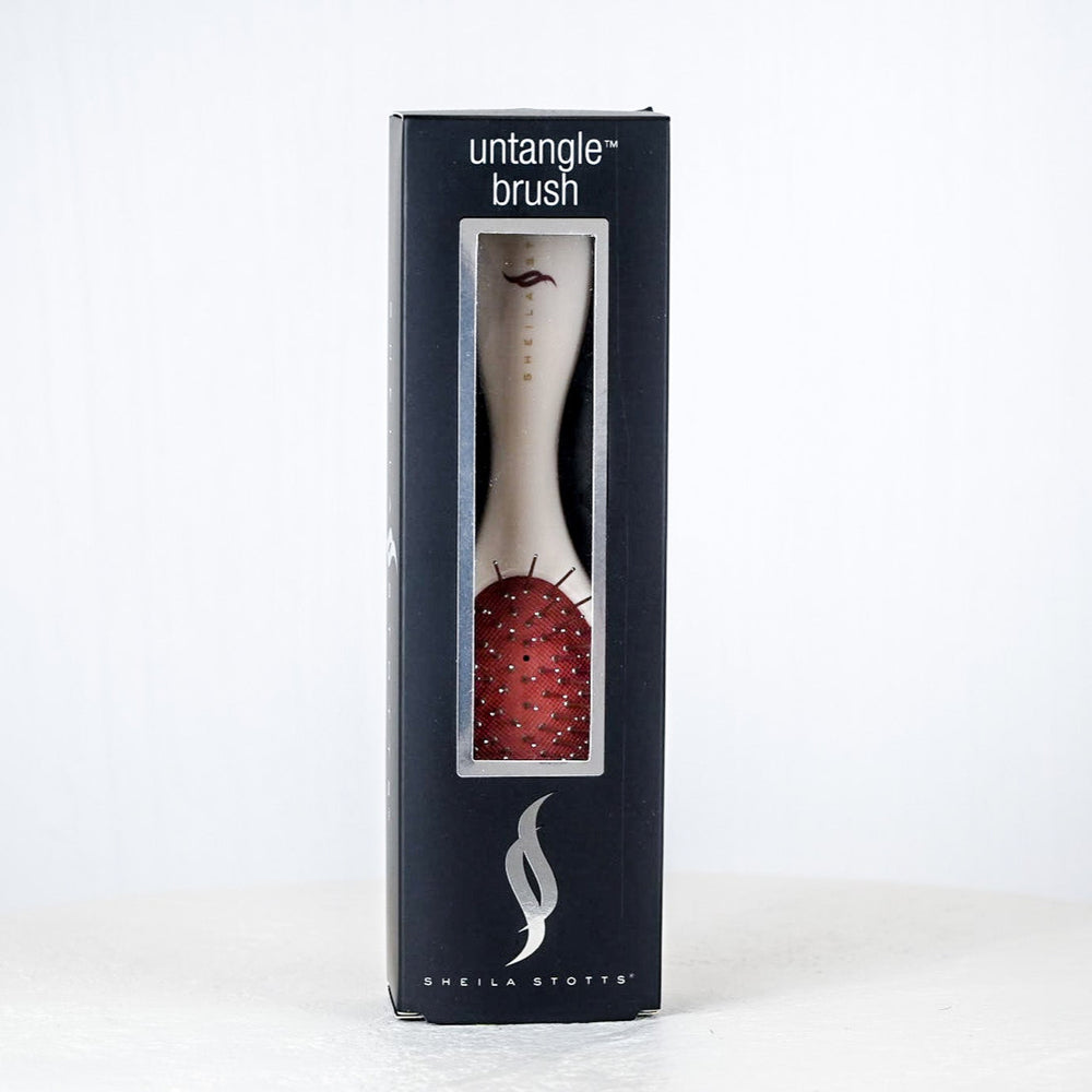 Untangle brush packaging on a white background