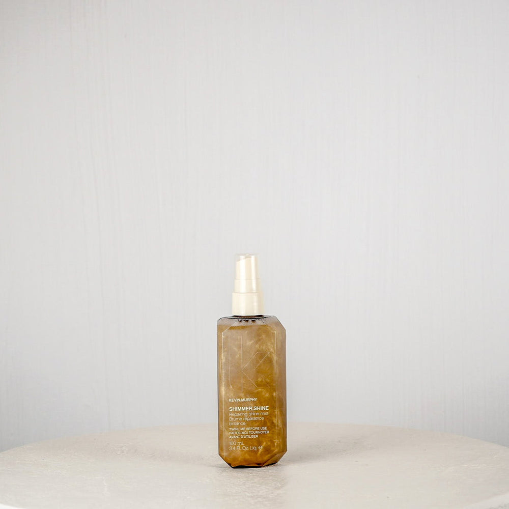 Skincare bottle on a white surface with a gray background