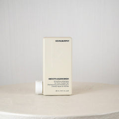 Kevin Murphy shampoo bottle on a white surface with a gray background