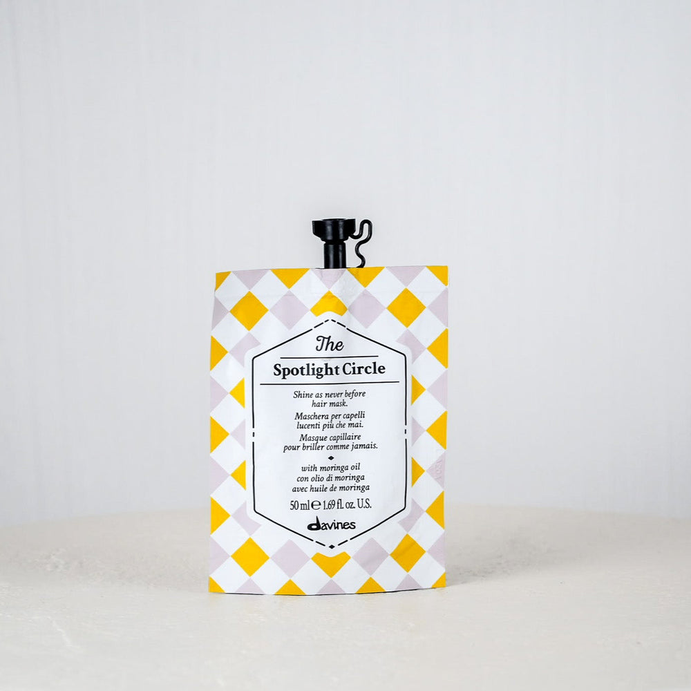 Product packaging with yellow and white checkered design on a plain background