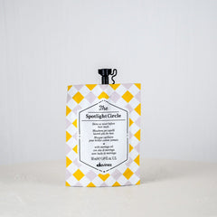 Product packaging with yellow and white checkered design on a plain background