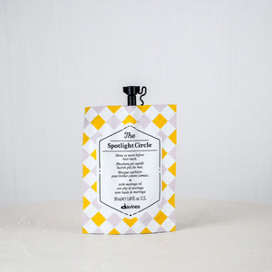 Product packaging with yellow and white checkered design on a plain background