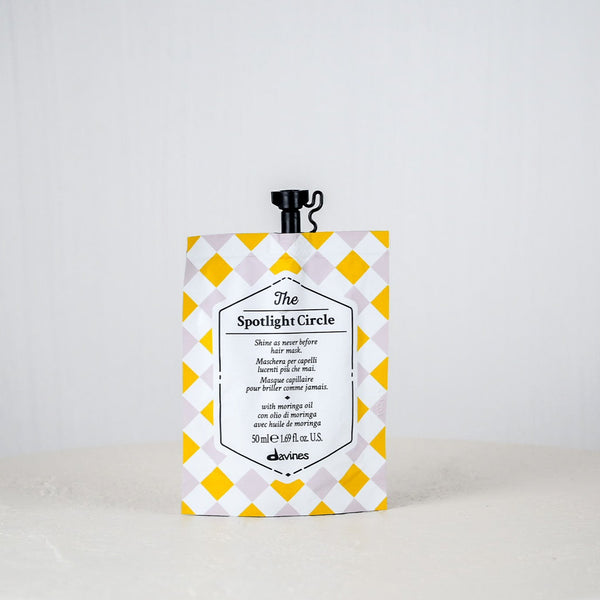 Product packaging with yellow and white checkered design on a plain background