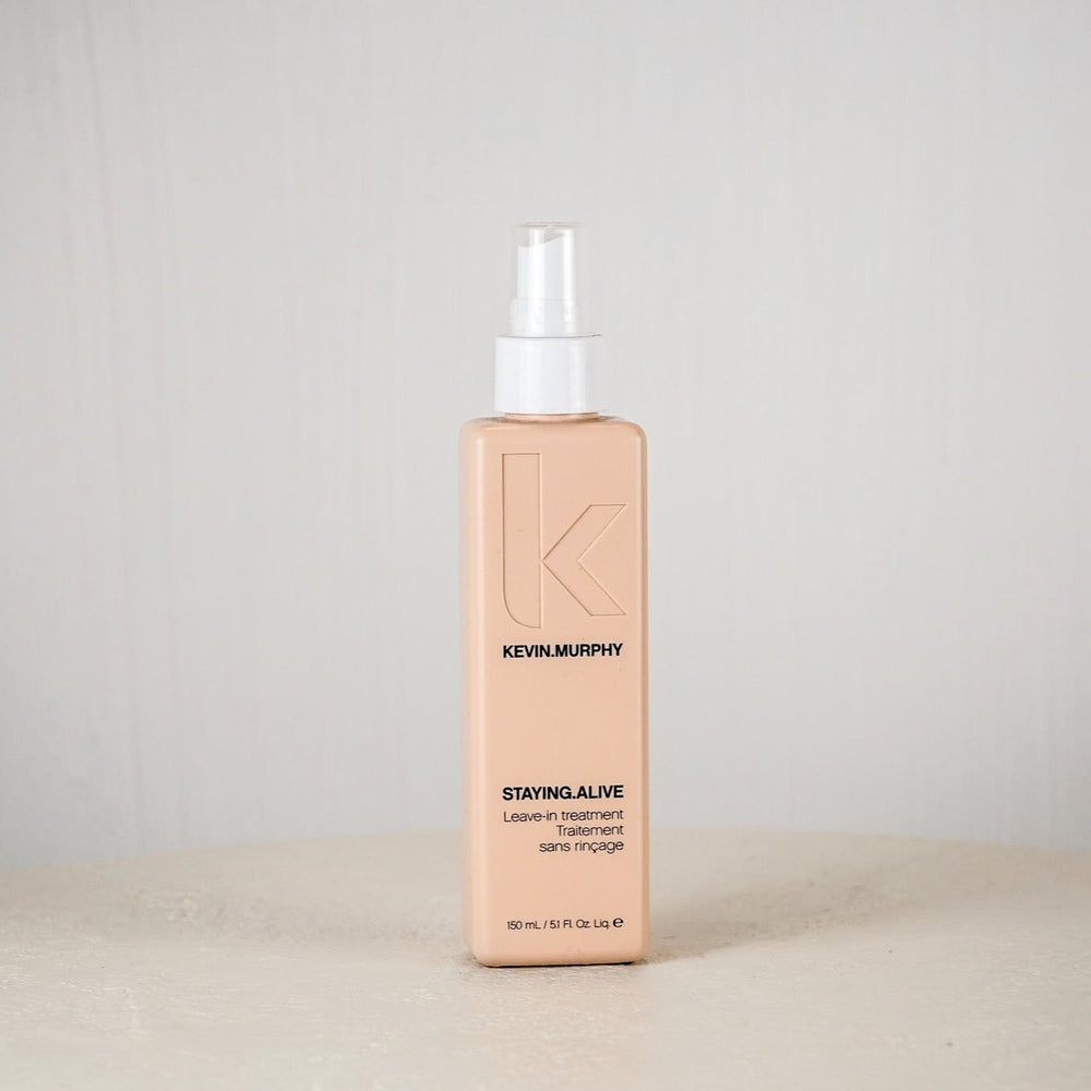 Kevin Murphy hair product bottle on a white surface with a light gray background