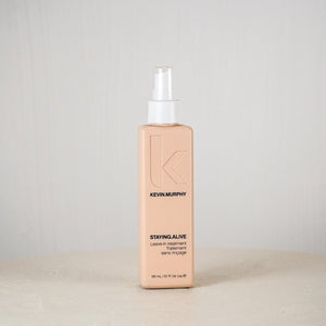Kevin Murphy hair product bottle on a white surface with a light gray background
