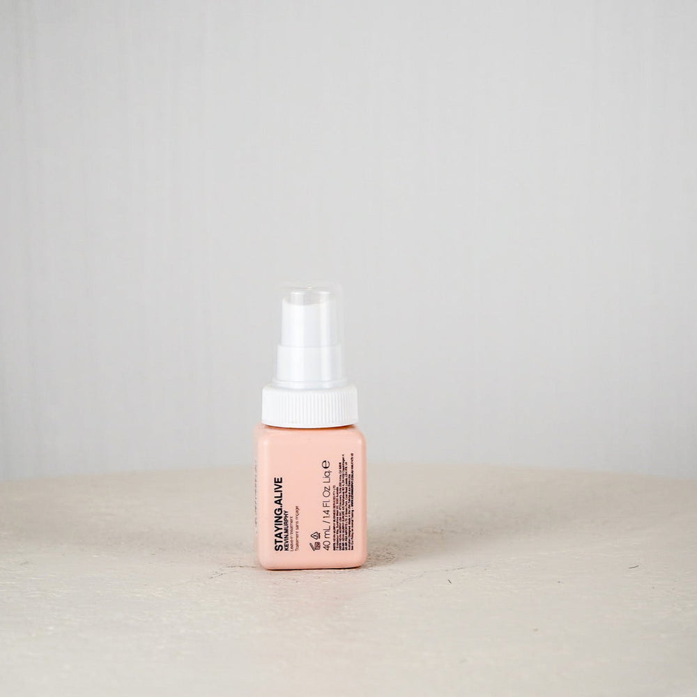 Kevin Murphy hair product bottle on a white surface with a light gray background
