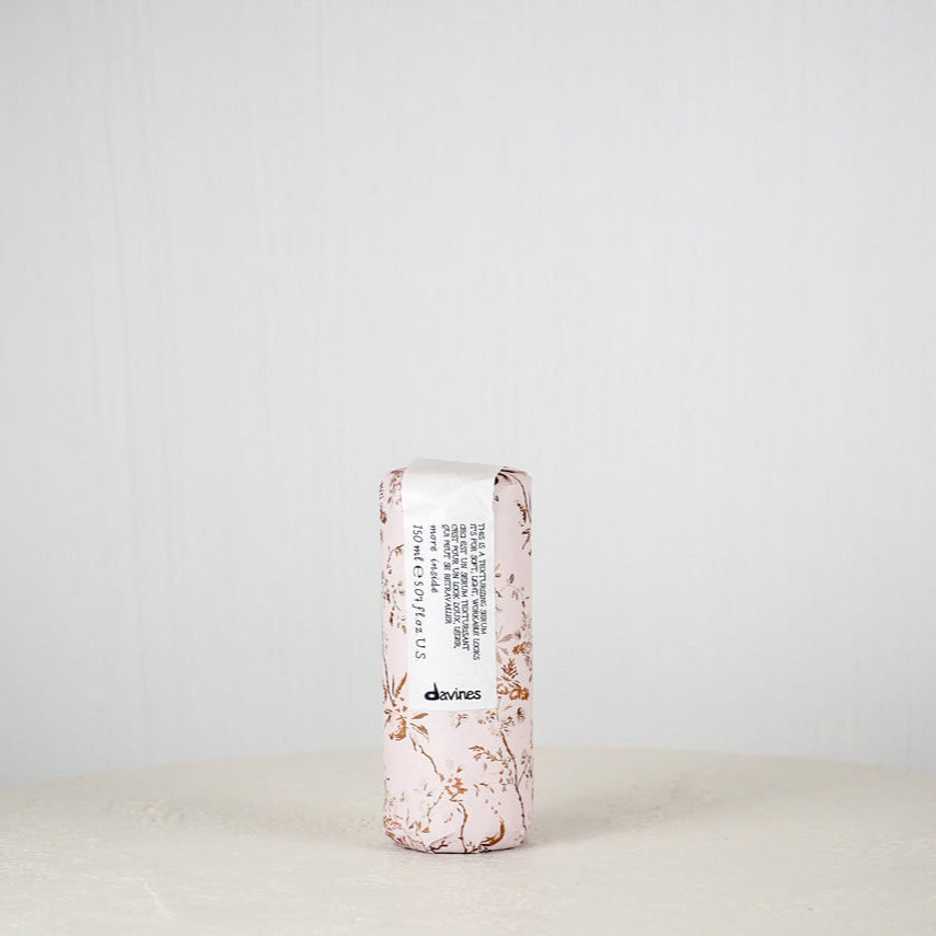 Skincare product with floral design on a white background