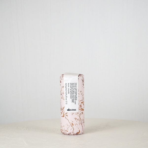 Skincare product with floral design on a white background