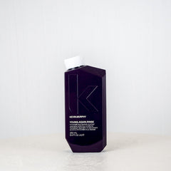 Kevin Murphy hair product bottle on a white surface with a white background