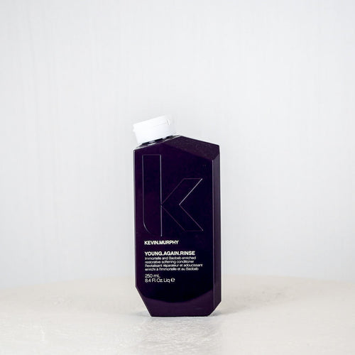 Kevin Murphy hair product bottle on a white surface with a white background